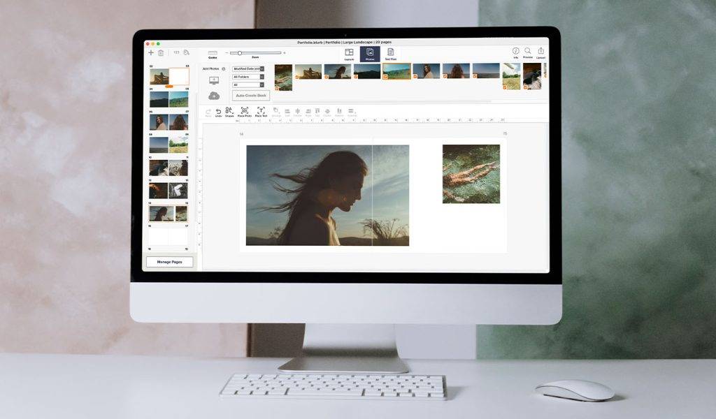 Business student working on a laptop creating a portfolio