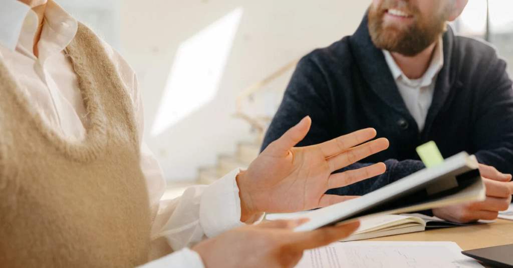 A Career Center advisor smiles while reviewing a student’s professional portfolio on a tablet